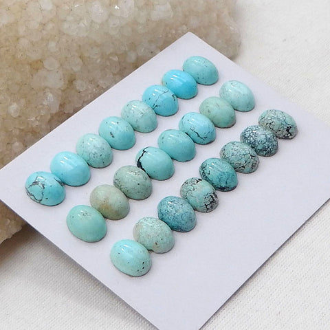 24 cabochons ovales bleu turquoise naturel, 9 x 7 x 4 mm, 7,9 g.