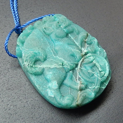 Beautiful Chrysocolla Carved Dog and Coin Pendant Bead, 35x27x7mm, 13.06g - MyGemGarden